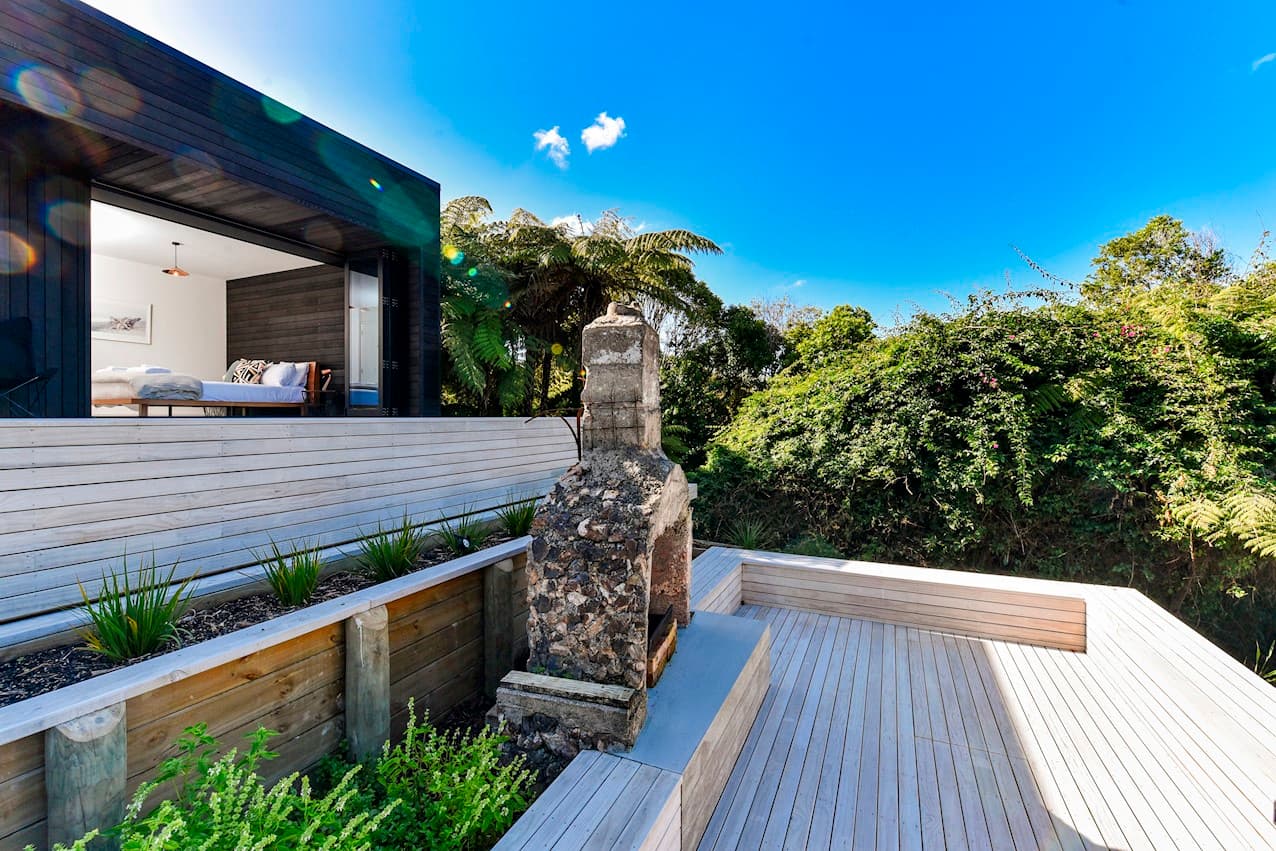Steps down to the outdoor fireplace